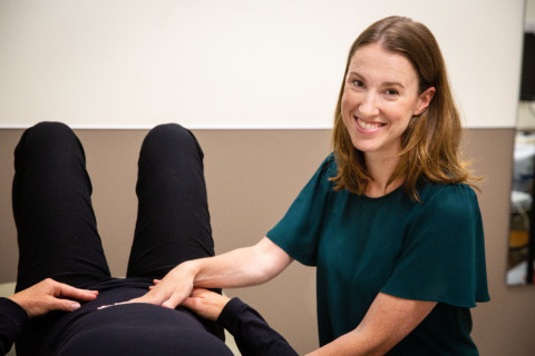 A physical therapist helps a patient regain mobility through physical therapy.