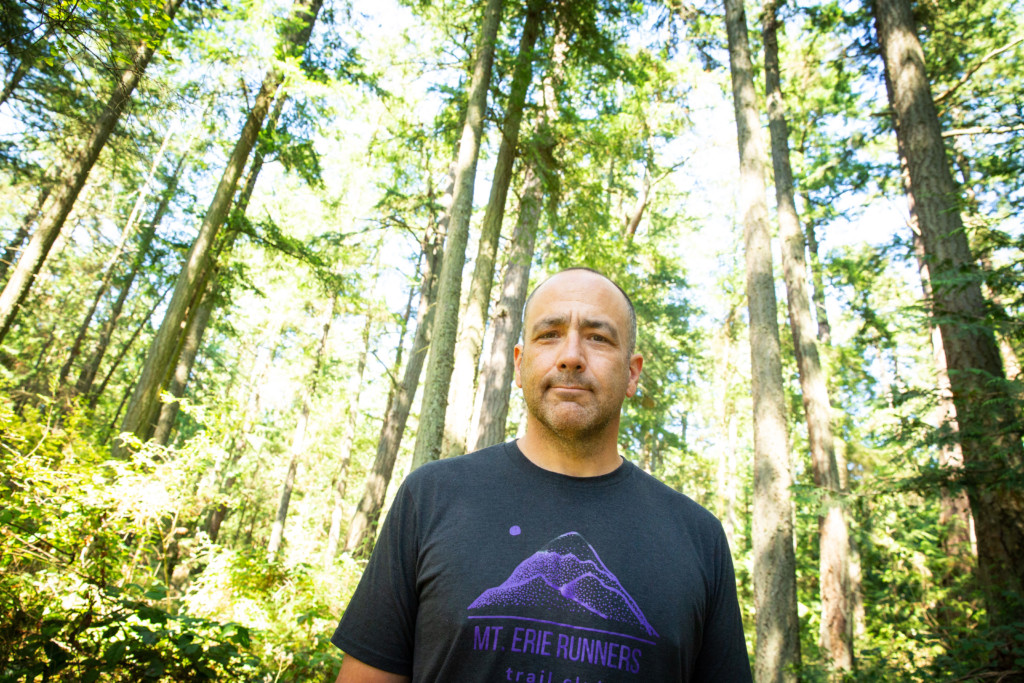 Man standing in the woods.