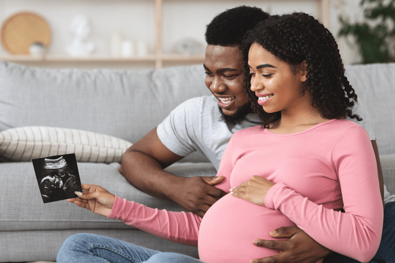 Couple looking at an ultrasound photo.
