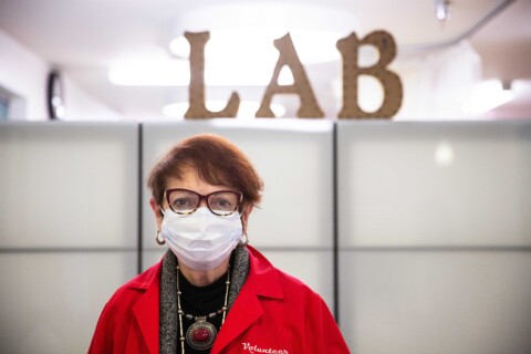 Female Lab Services volunteer wearing mask.