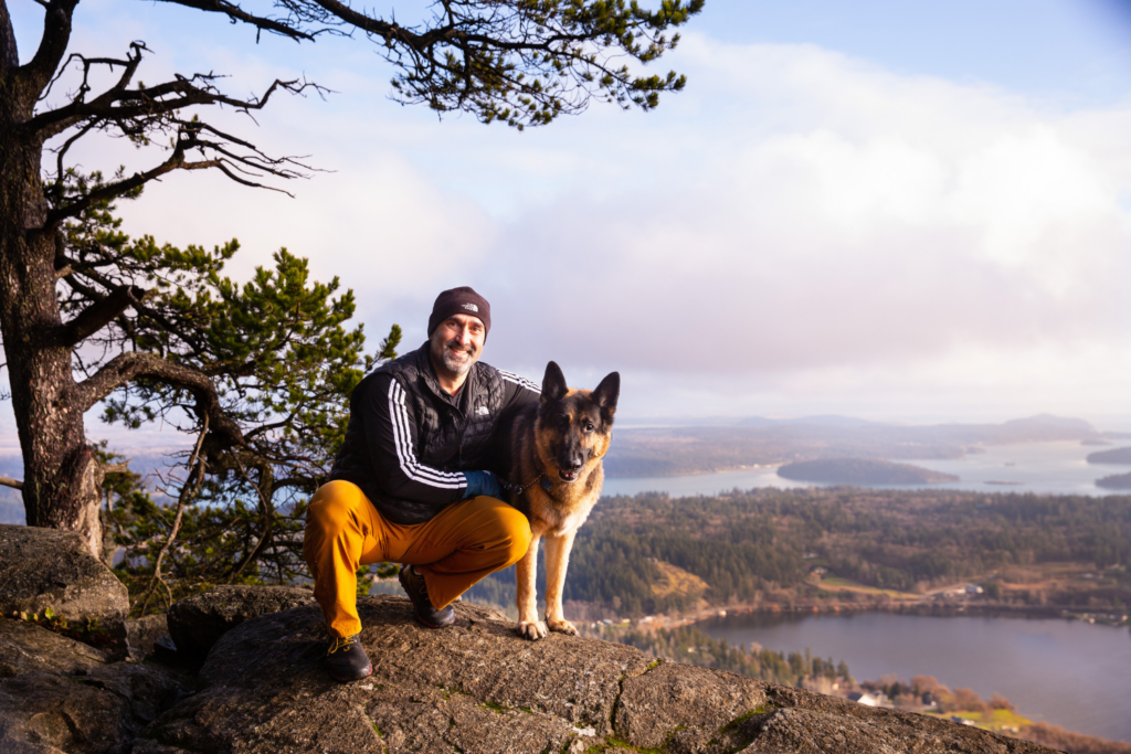 Dr. Ali Salari on the top of Mt. Erie with his dog Koda.