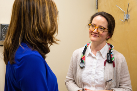 Family Medicine Provider Sara Weeks, DO listening to a patient.