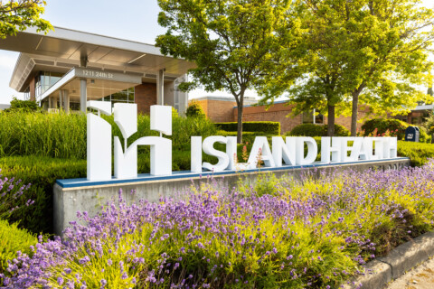 Island Health three-dimensional entrance sign in roundabout.