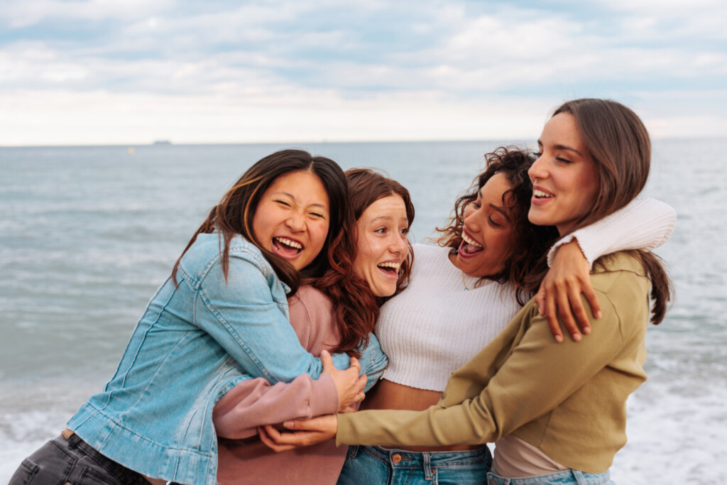 Group of women smiling and hugging