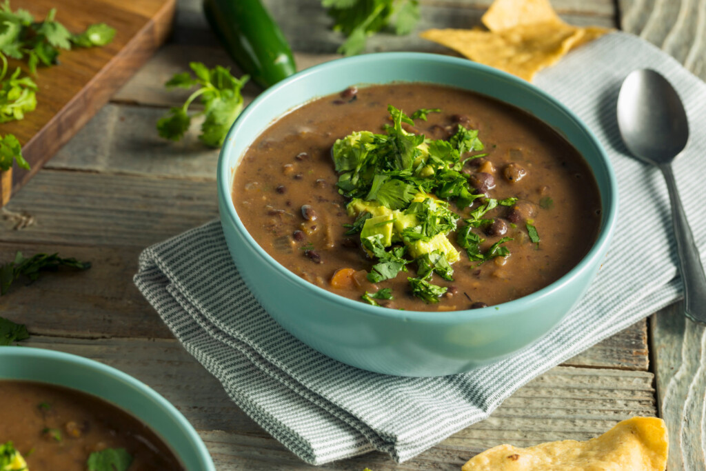 black bean soup in teal bowl