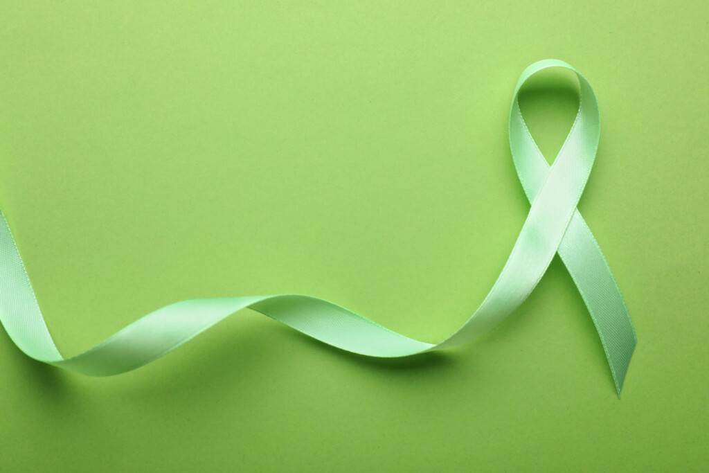 Green ribbon across the screen honoring mental health awareness.