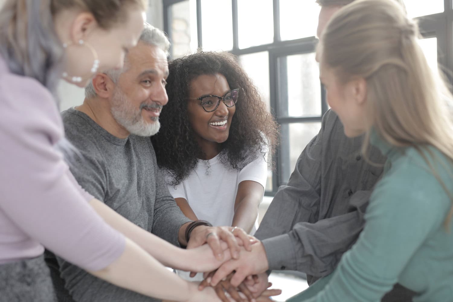 Group of diverse individuals in support group