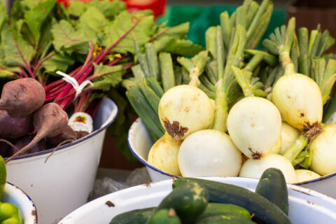 Beets, onions and cucumbers in bowls at Farm Stand.