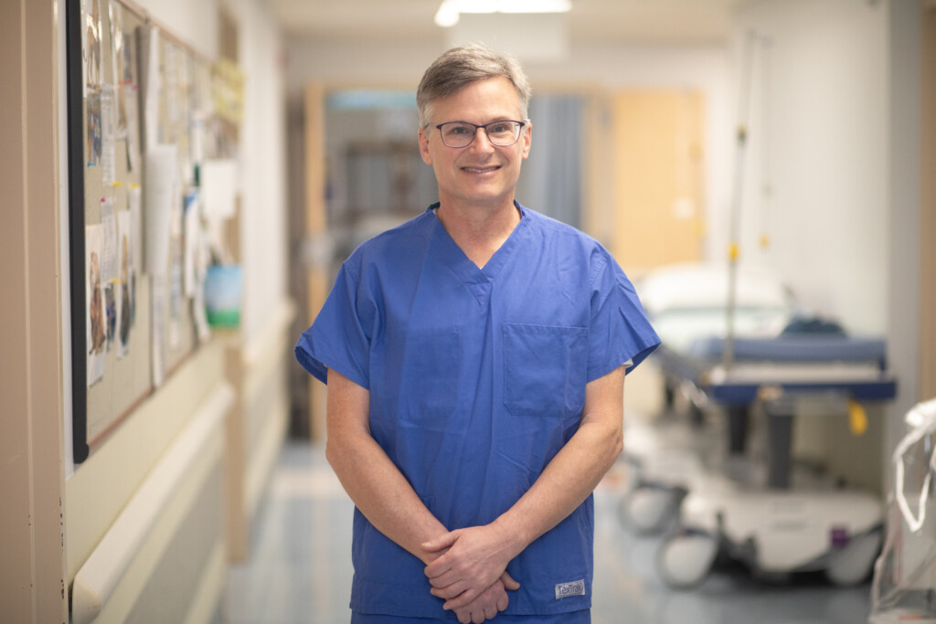 Dr. Clemons in blue scrubs at Island Urogynecology.