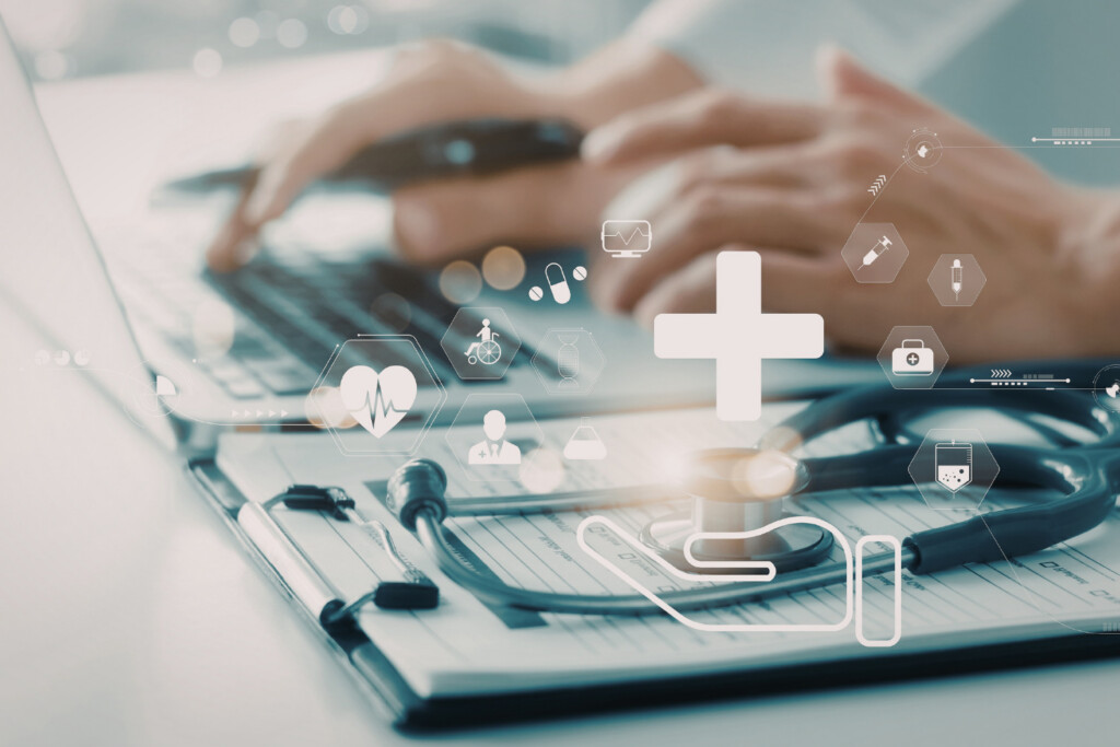 Hands over medical paperwork with graphics of medical icons overlaid.