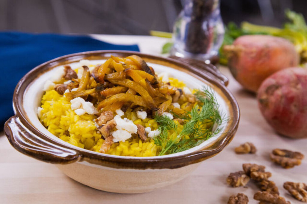 golden beet risotto in a bowl.