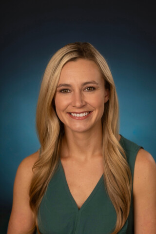 Dr. Sheena Wisler, Obstetrician and Gynecologist, smiling at camera.