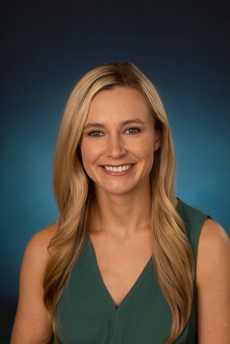 Dr. Sheena Wisler, Obstetrician and Gynecologist, smiling at camera.