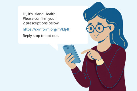 Woman receiving a text message to confirm her prescriptions.