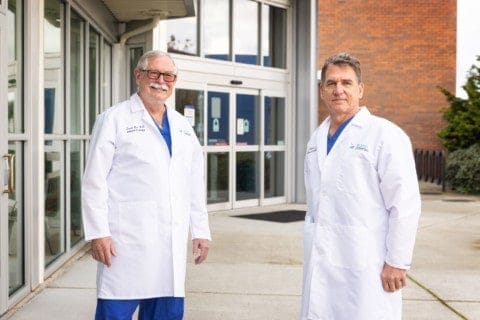 Island Urologists standing outside the 25th Street building