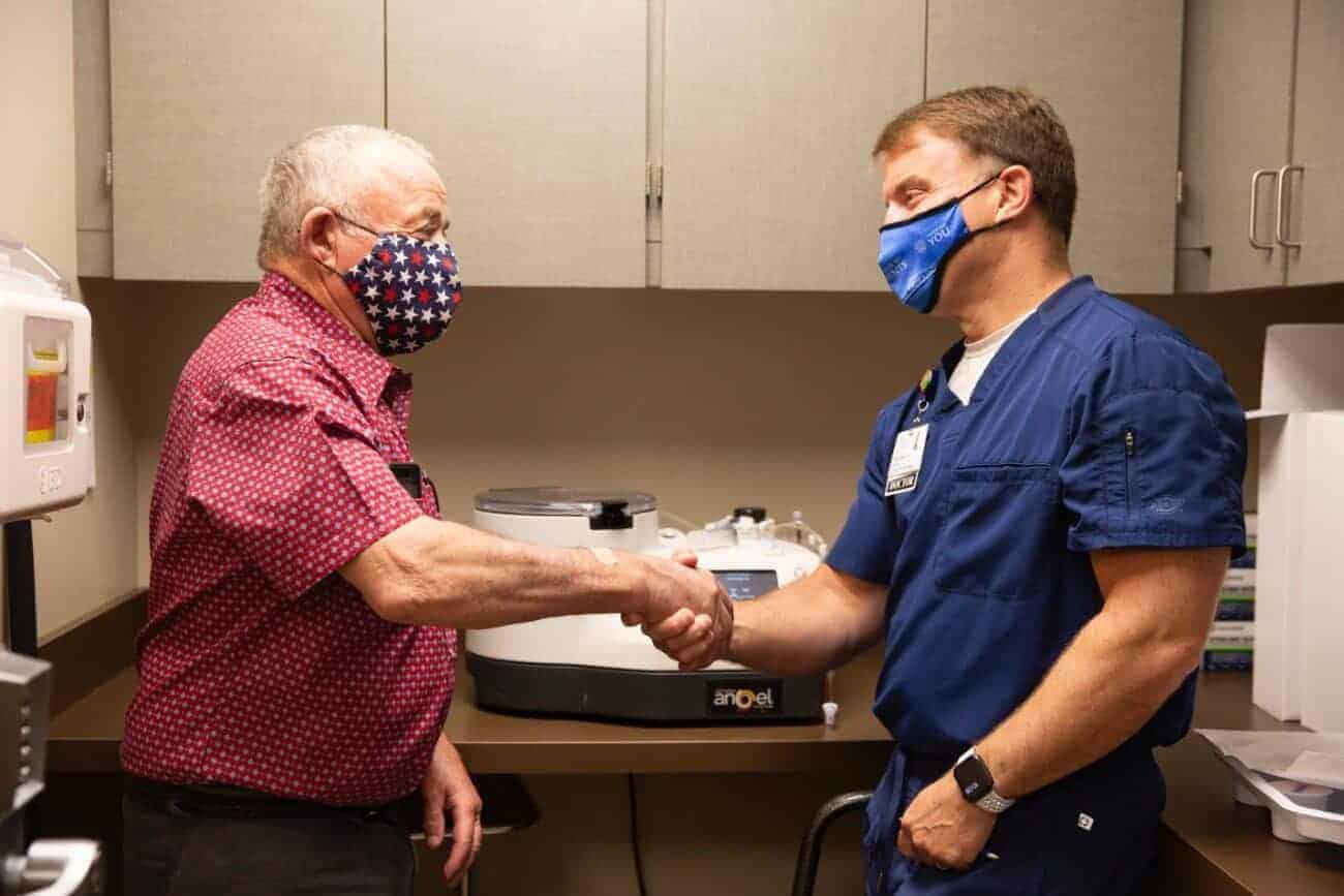 Island Health provider shaking man's hand